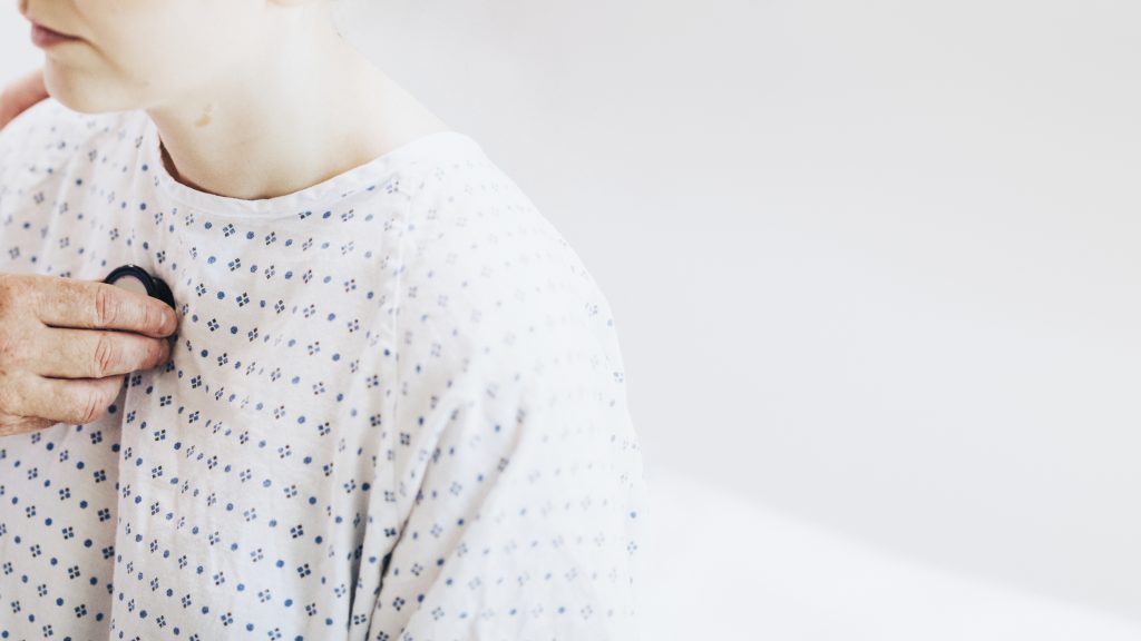 Doctor checking patient for lung cancer