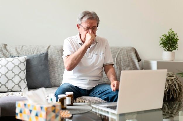 man coughing because of lung cancer