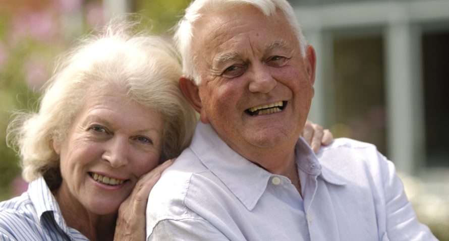Senior couple with beautiful teeth aligners