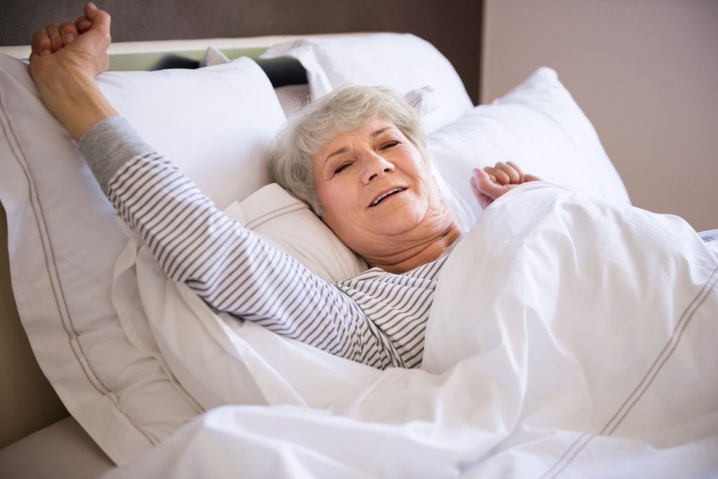 Woman waking up to a good sleep in a nice mattress