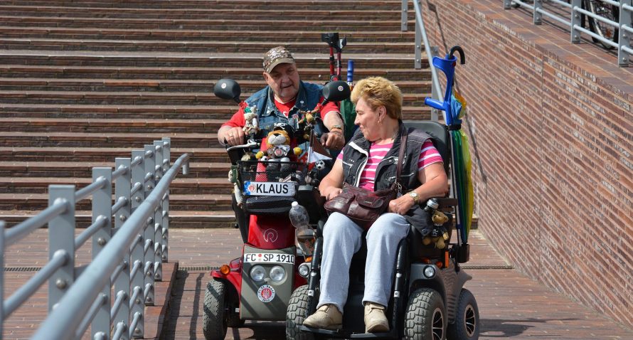 seniors in mobility scooters