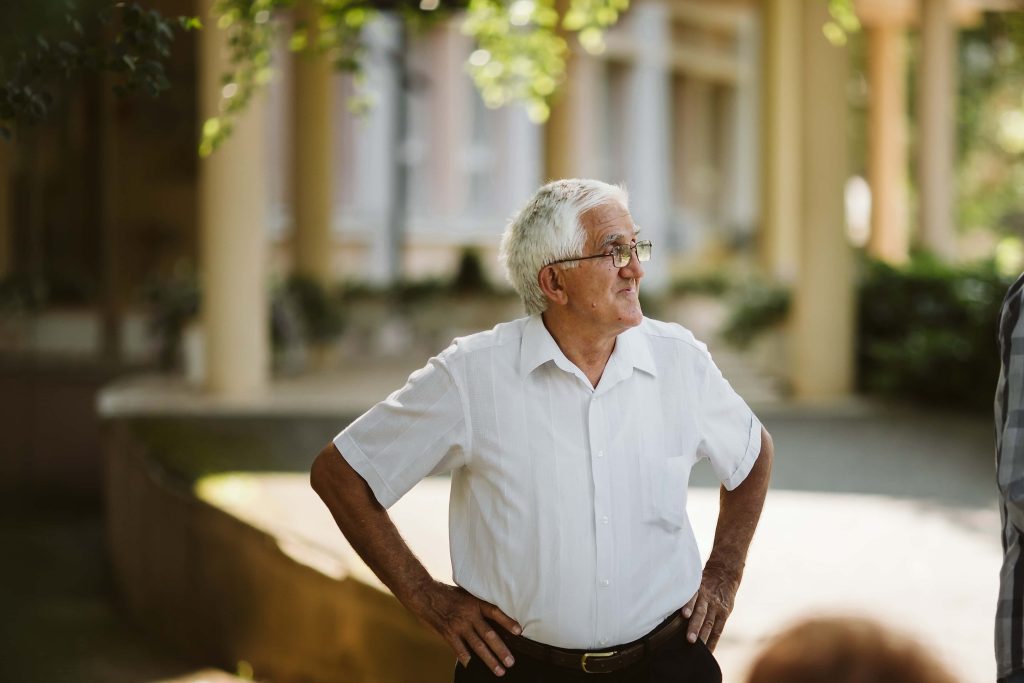 Smiling elderly man getting a check up