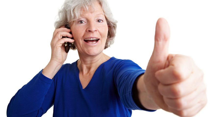woman holding a senior-friendly cell phone