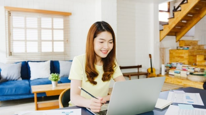 woman happily working from home