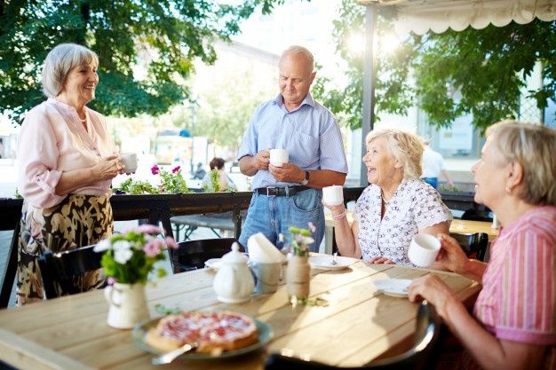 happy seniors in assisted living facility