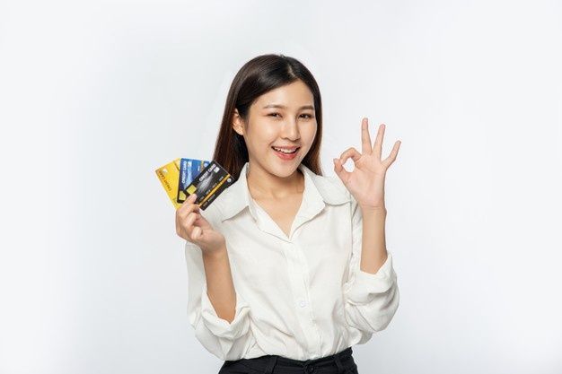 woman holding credit cards